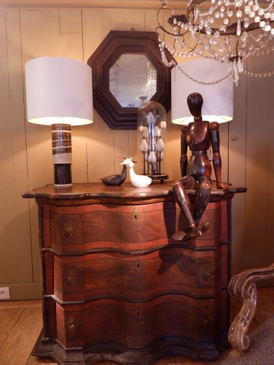 Double curved chest of drawers with brown faux wood decor ca.1800