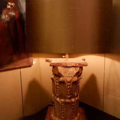 An antique gilded wood capital lamp + golden silk shade