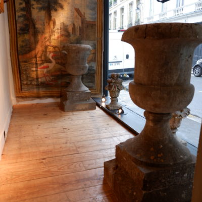 A PAIR OF STONE VASES ON A BASE 18TH CENTURY