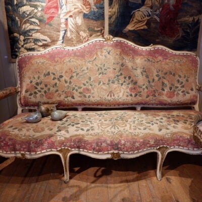 Large bench Louis XV covered with a tapestry in the small point decoration of roses ca.1800