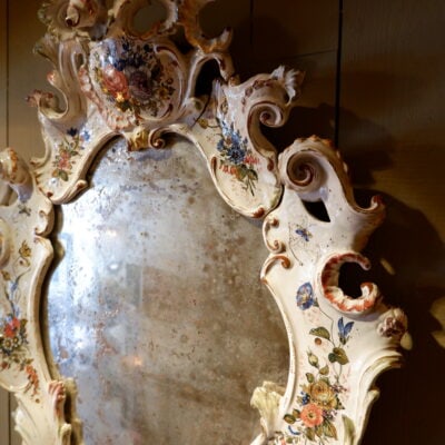 Large baroque porcelain mirror with painted flowers and feet in the shape of dolphin heads - Italy end of XIXth century