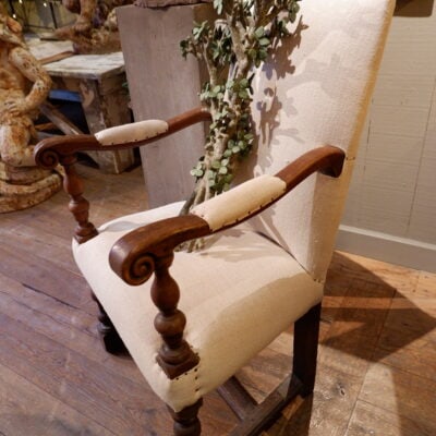 Louis XIII armchair in walnut covered with old linen
