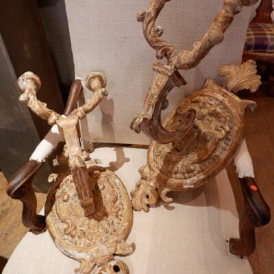 A pair of medallion sconces in carved wood 18th century