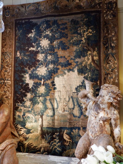 Large Aubusson tapestry depicting a castle and its garden on a background of greenery and animals - ca.1780