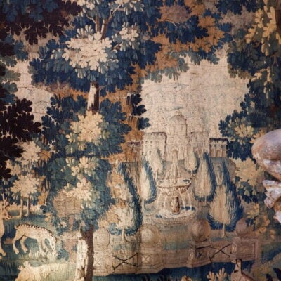 Large Aubusson tapestry depicting a castle and its garden on a background of greenery and animals - ca.1780