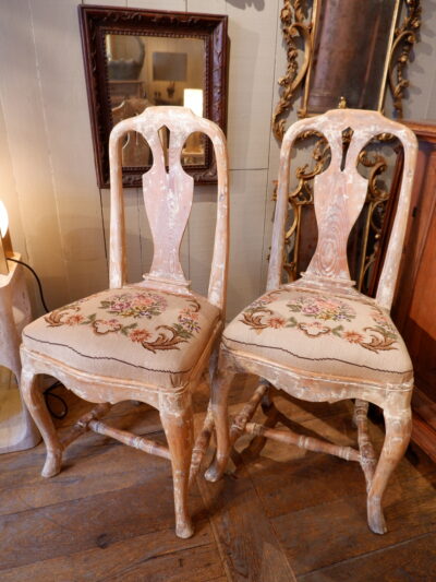 A pair of white patina chairs sitting in small point ca.1800