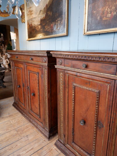 PAIR OF ITALIAN CARVED WALNUT SIDEBOARDS FROM THE 17TH CENTURY