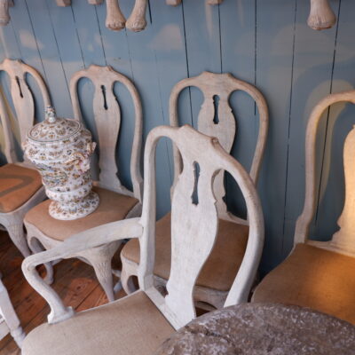 Rare suite of 10 chairs and 2 baroque armchairs with white patina from the 19th century