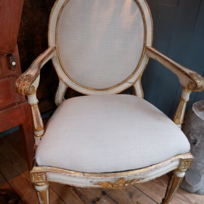 Elegant pair of 18th century frame armchairs in ivory lacquer and gold leaf