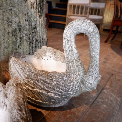 Pair of swans in cement with mossy patina, late 19th century