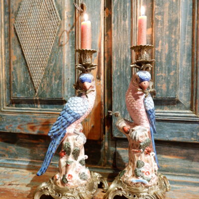 Pair of porcelain "parrots with white & blue plumage" candlesticks on chased bronze bases, early 19th century