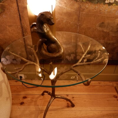 Bronze patina pedestal table with glass top
