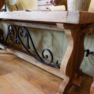 Large walnut console with wrought-iron scrolled braces, late 19th century