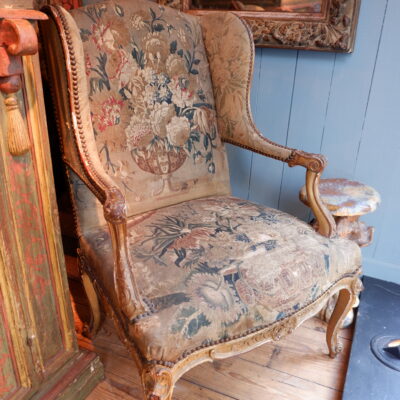 Regency gilded wood armchair covered with fine tapestry from the 19th century