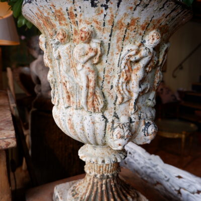 Pair of white cast-iron vases with neo-classical farandole décor and masked handles