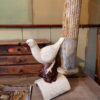 Tuile faitière en terre cuite vernissée - figurant un oiseau- émail beige début XIXe