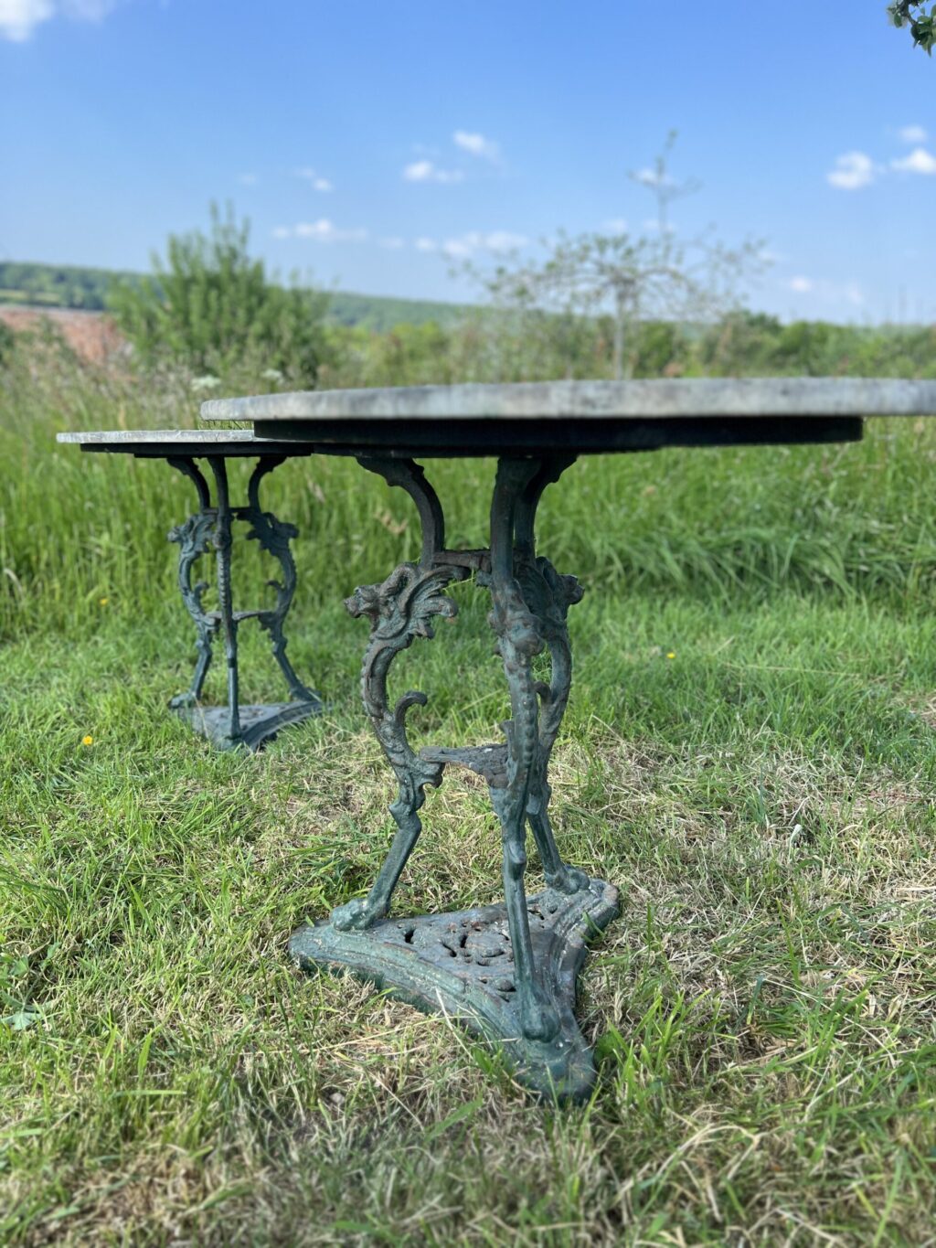 Pair of oval garden pedestal tables