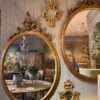 Paire de trés grands miroirs ovals en bois doré et sculpté- Italie XIXe