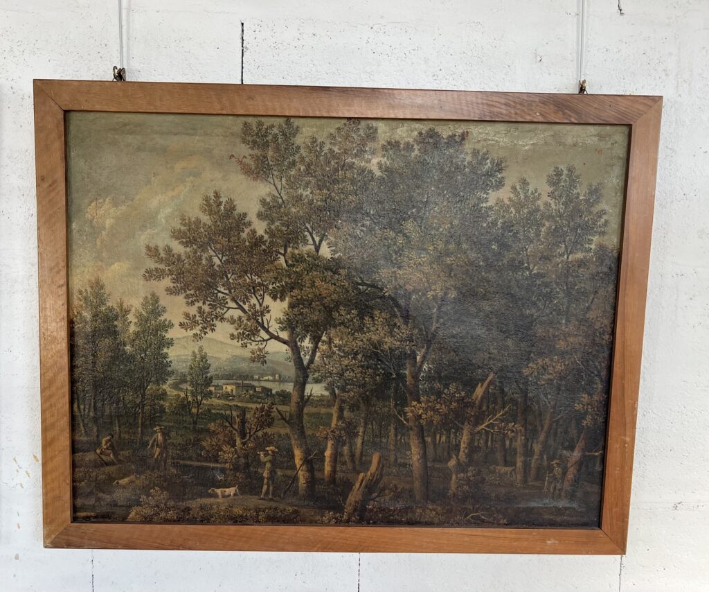 Paire de tableaux italiens anciens représentant des paysages ruraux animés et chasseurs, encadrés en bois de chêne